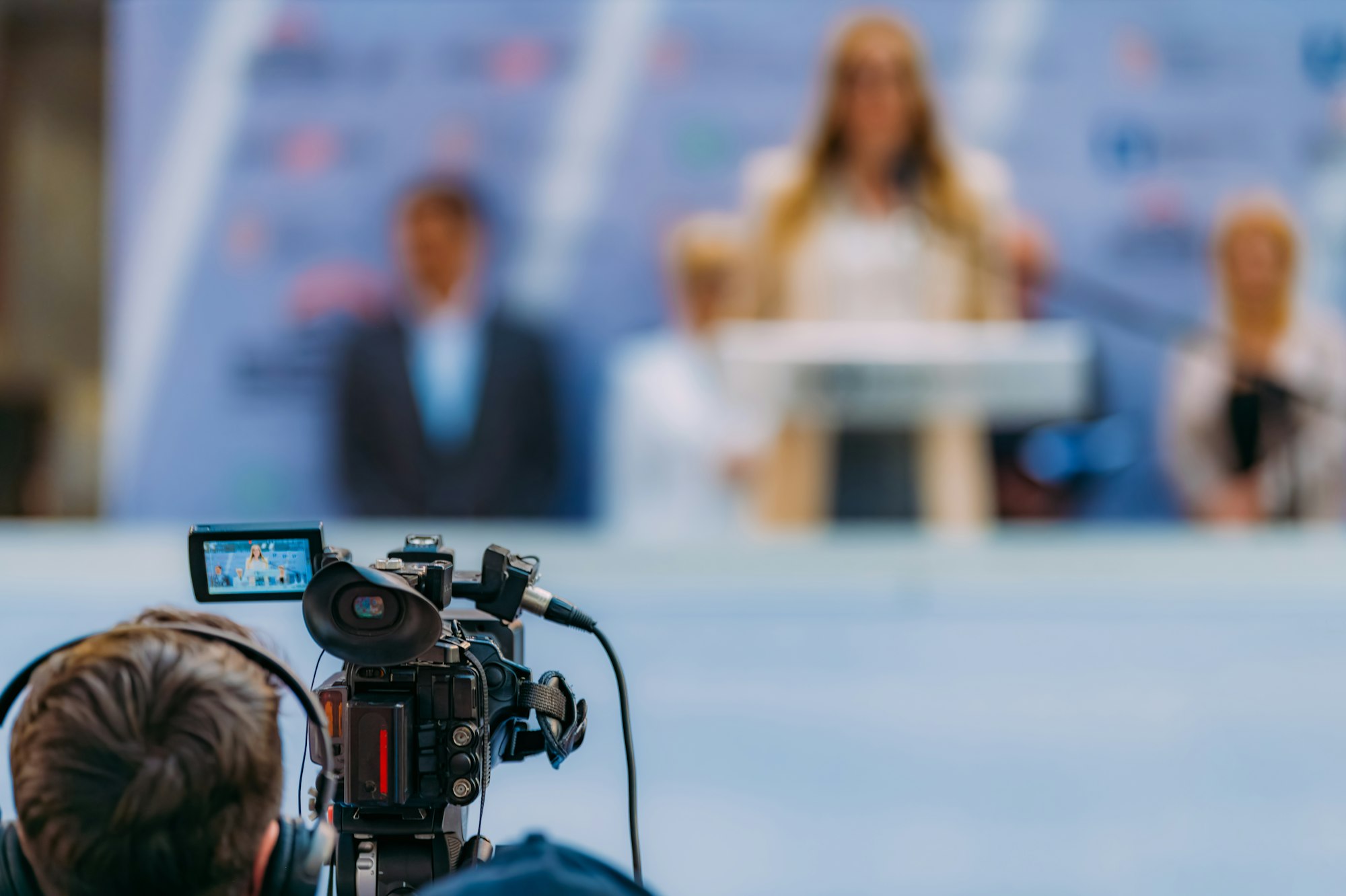 Media cameras capture moments at a trade show